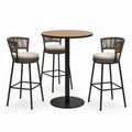Ensemble table ronde en bois et métal avec tabourets en corde et coussins beige